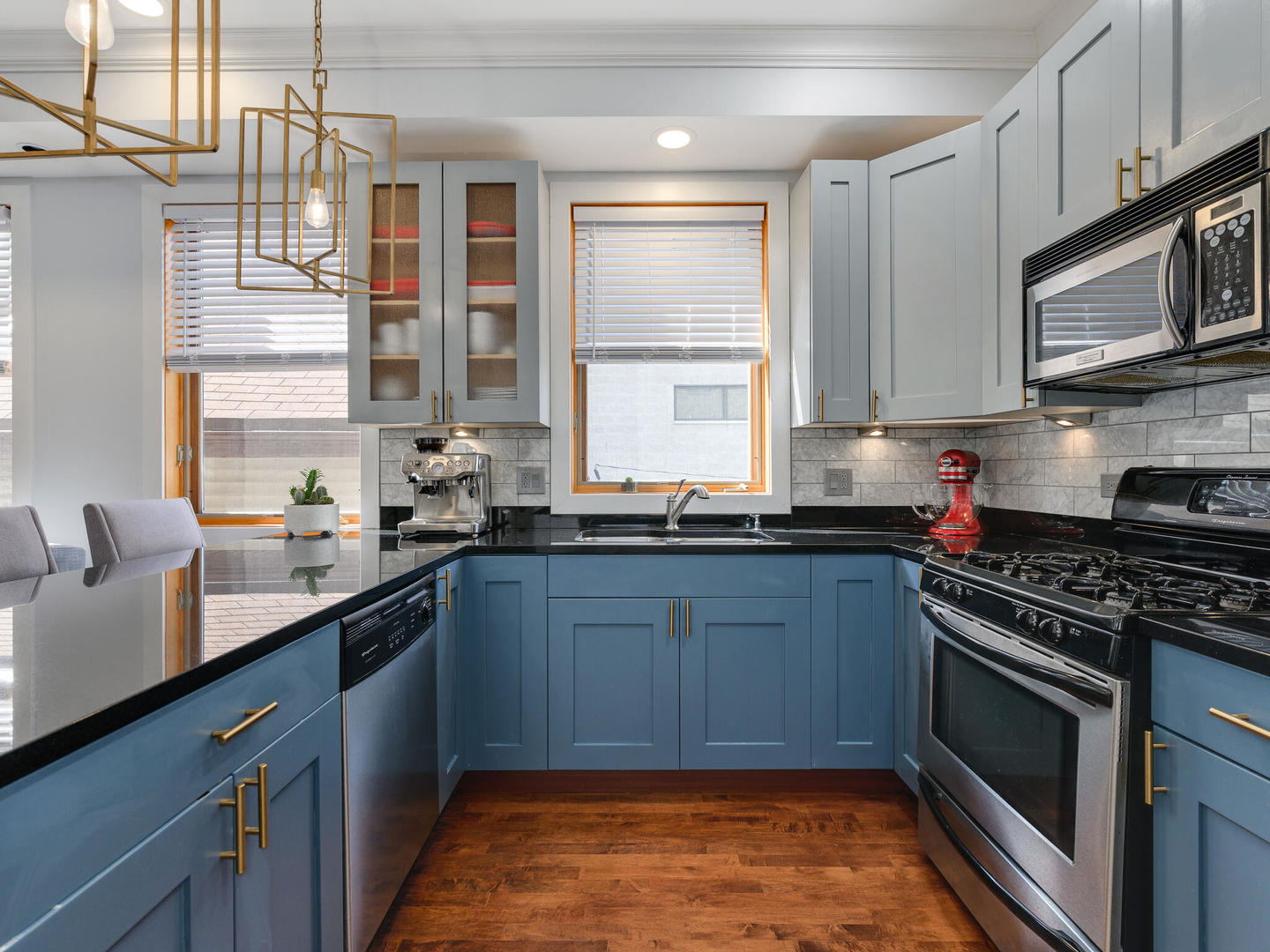 1834 West Rice Street, Unit C Chicago, IL 60622 - Photo 7 of 31 a kitchen with stainless steel appliances a stove sink and microwave