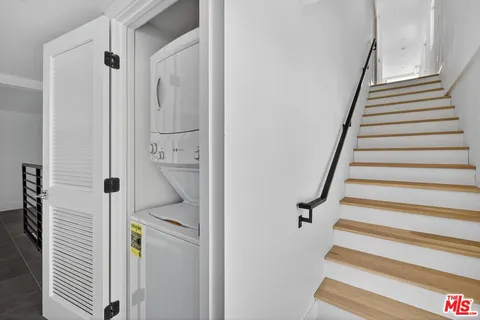 a bathroom with a shower and a sink