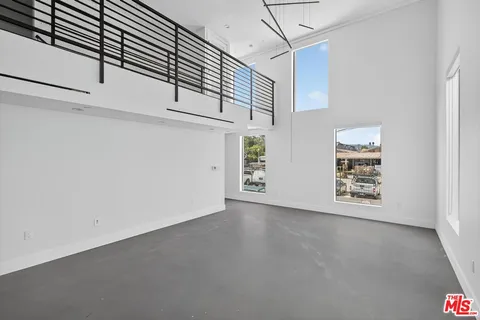 a view of a hallway with a window
