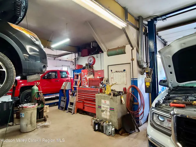 a kitchen with kitchen island a sink stove and refrigerator