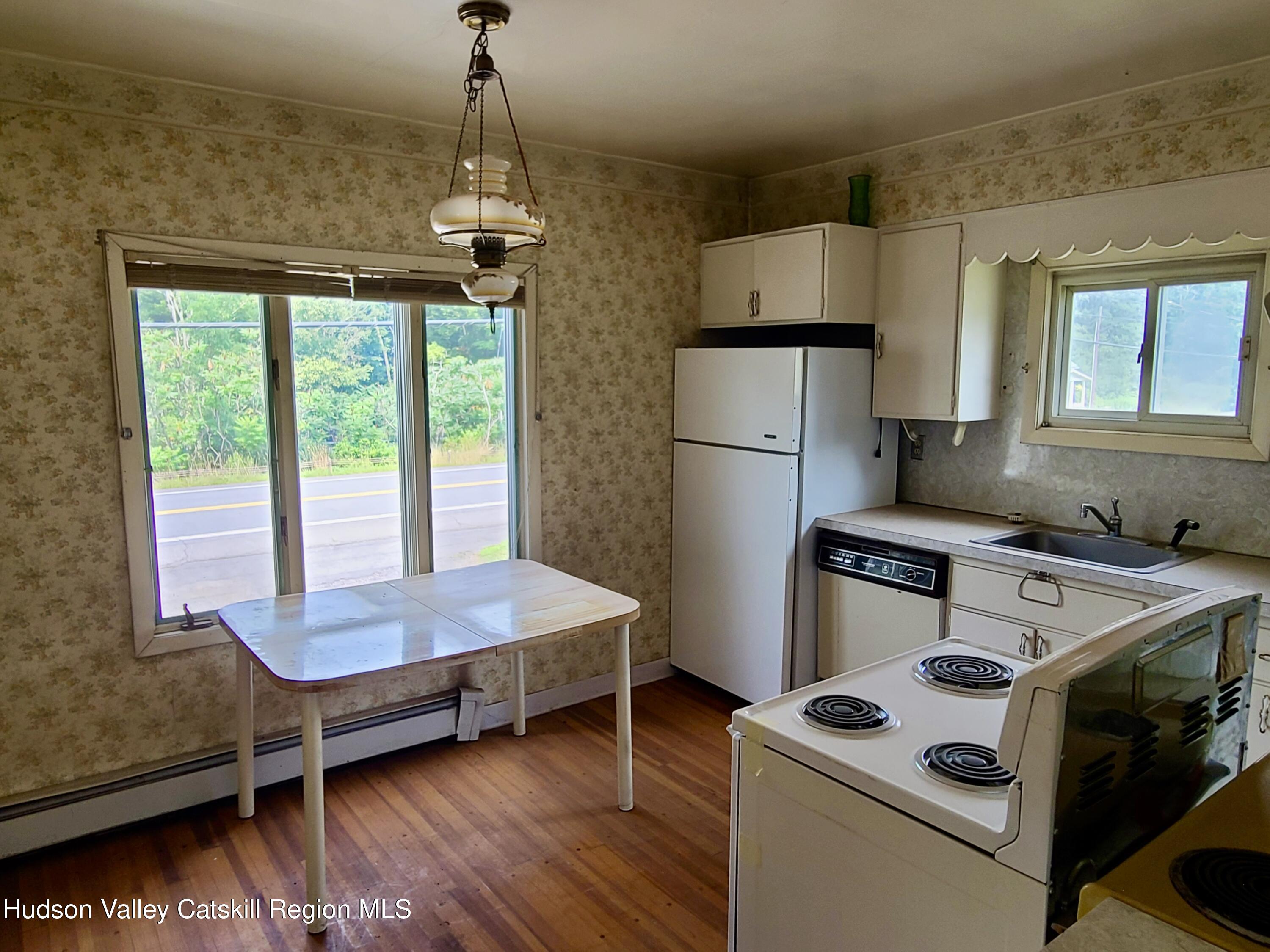 53200 Highway 30 Roxbury, NY 12421 - Photo 16 of 44 a bed room with furniture and windows