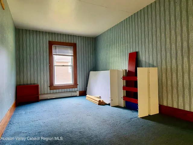 a view of hallway with wooden floor