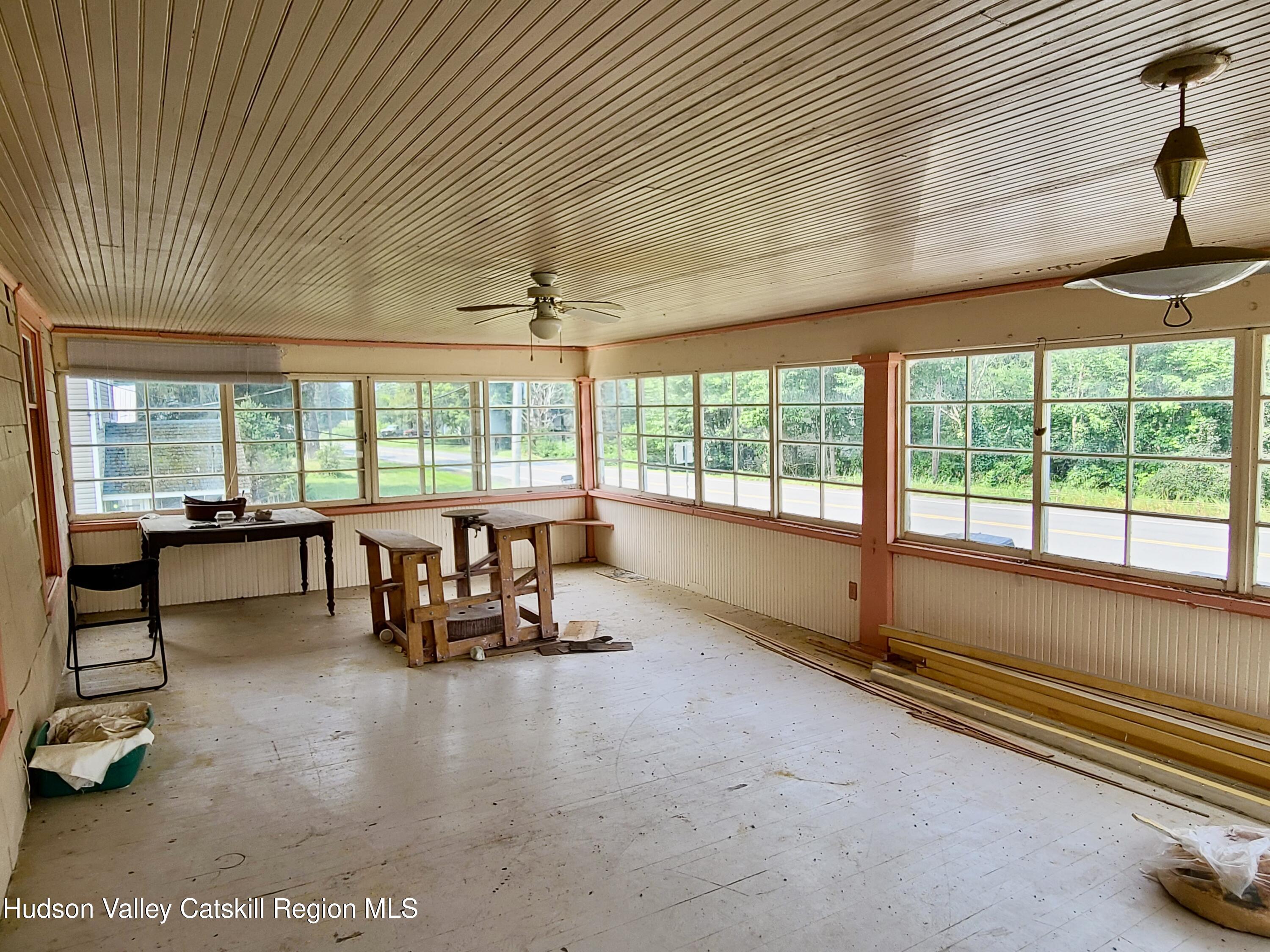 53200 Highway 30 Roxbury, NY 12421 - Photo 34 of 44 a living room filled with furniture and a large window