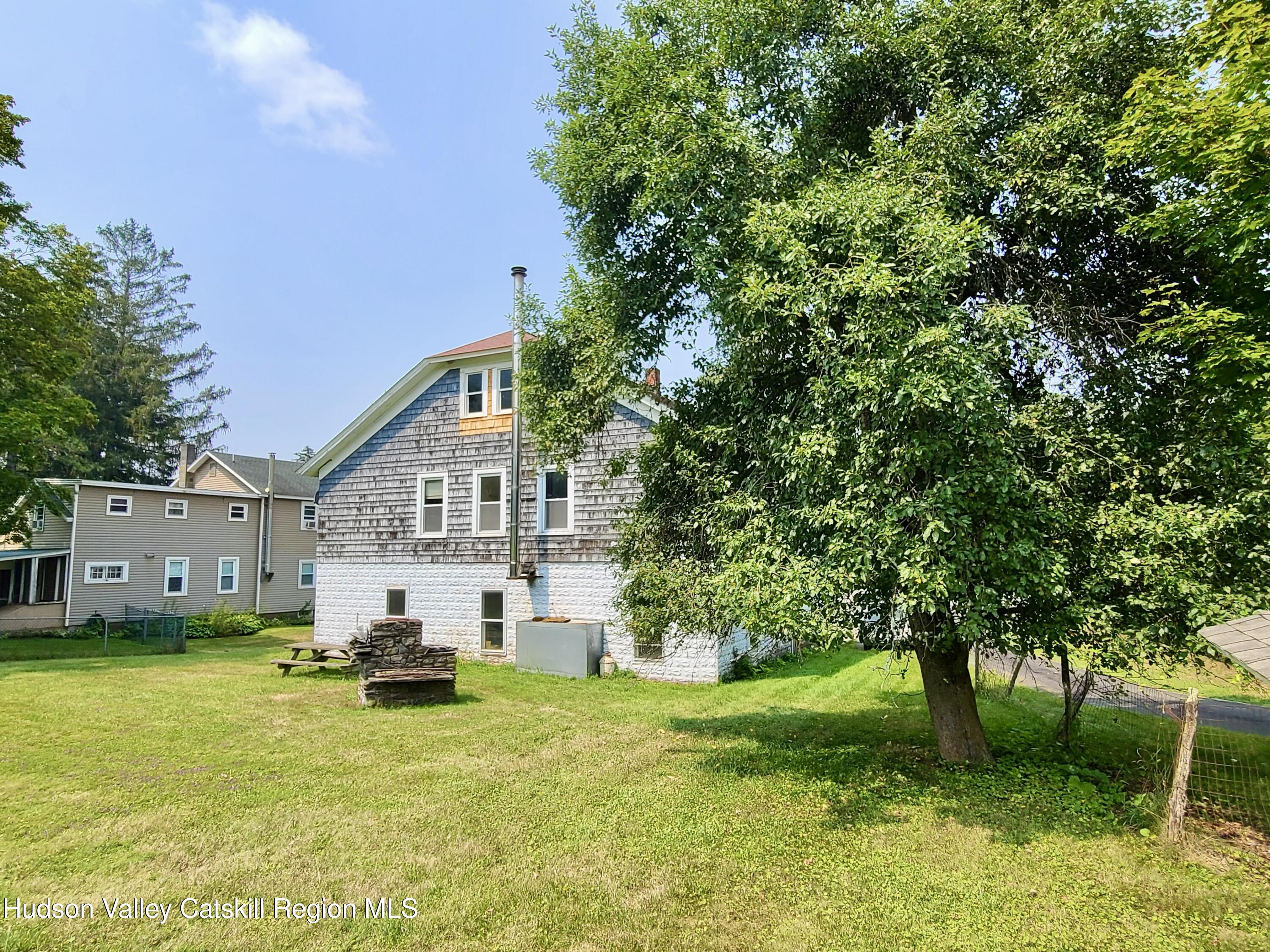 53200 Highway 30 Roxbury, NY 12421 - Photo 41 of 44 a view of a house with a yard and a tree