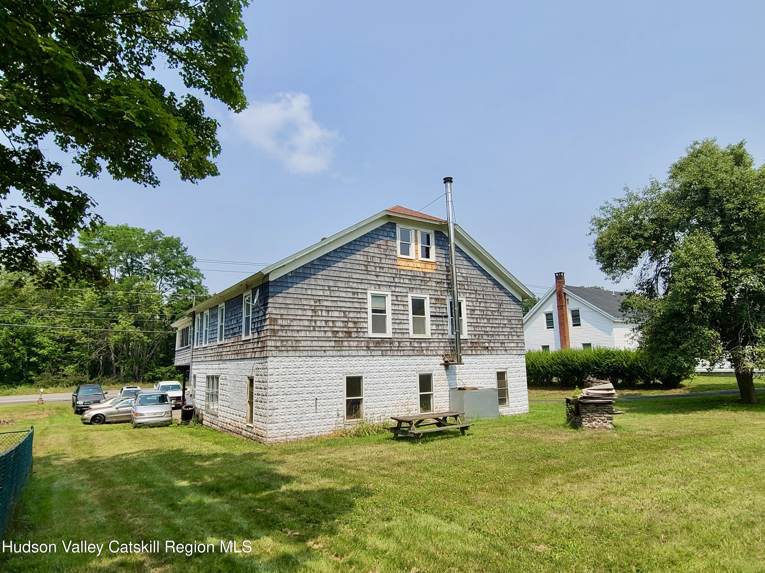 53200 Highway 30 Roxbury, NY 12421 - Photo 42 of 44 a view of a house with a yard porch and sitting area