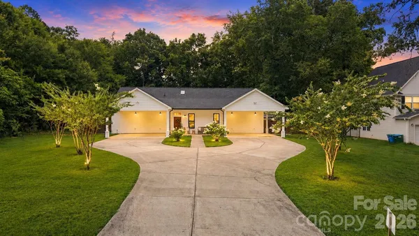 a view of a house with a yard porch and sitting area