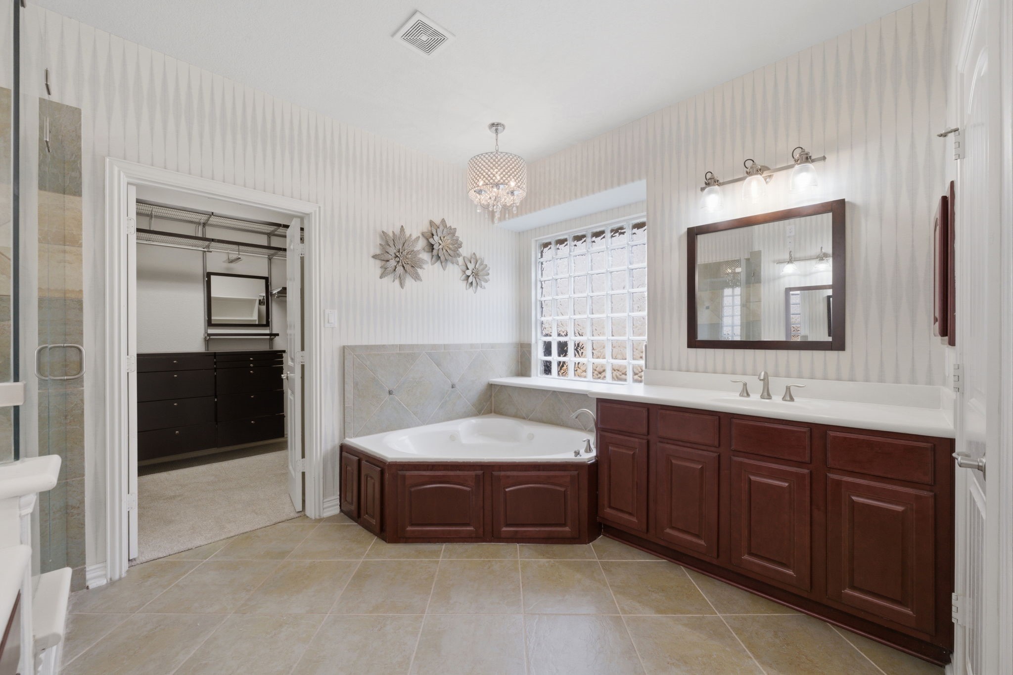 315 Arbor Ridge Lane Conroe, TX 77384 - Photo 22 of 48 a spacious bathroom with a tub double sink and mirror