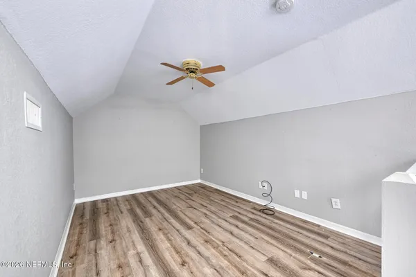 a view of entryway with wooden floor