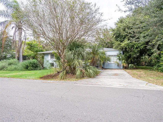 front view of a house with a garden