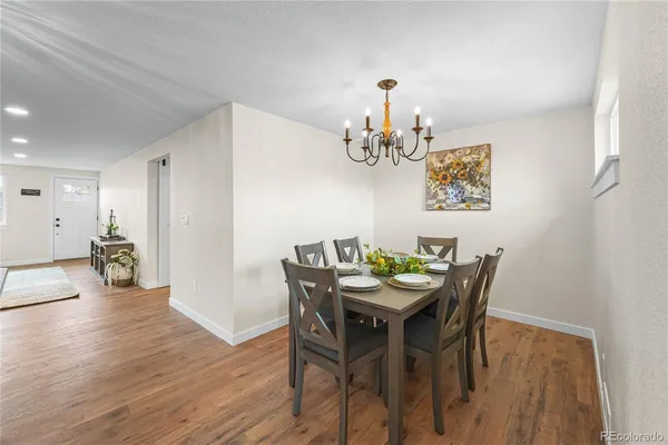 a view of a dining room with furniture and wooden floor