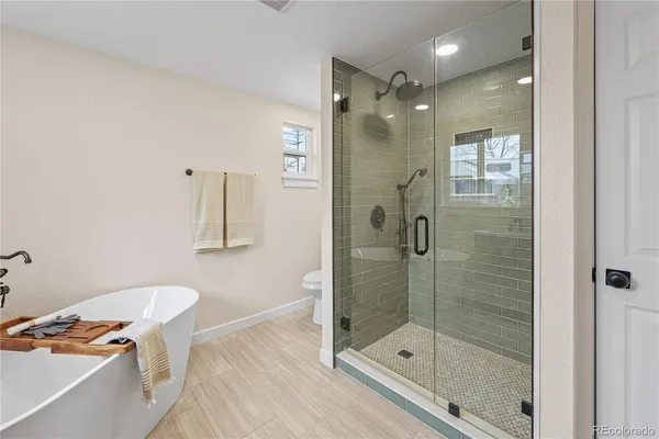 a bathroom with a shower and a sink