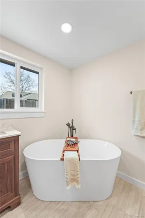 a white bath tub sitting in a bathroom