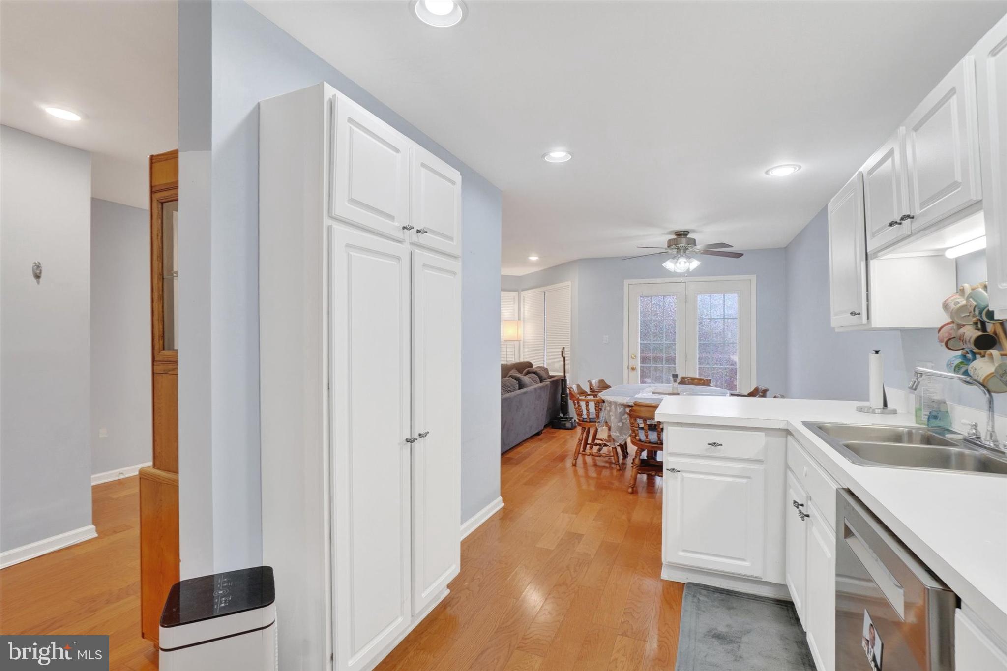 115 Oak Ridge Lane, Unit 115 Dallastown, PA 17313 - Photo 12 of 32 a large white kitchen with lots of counter space and windows