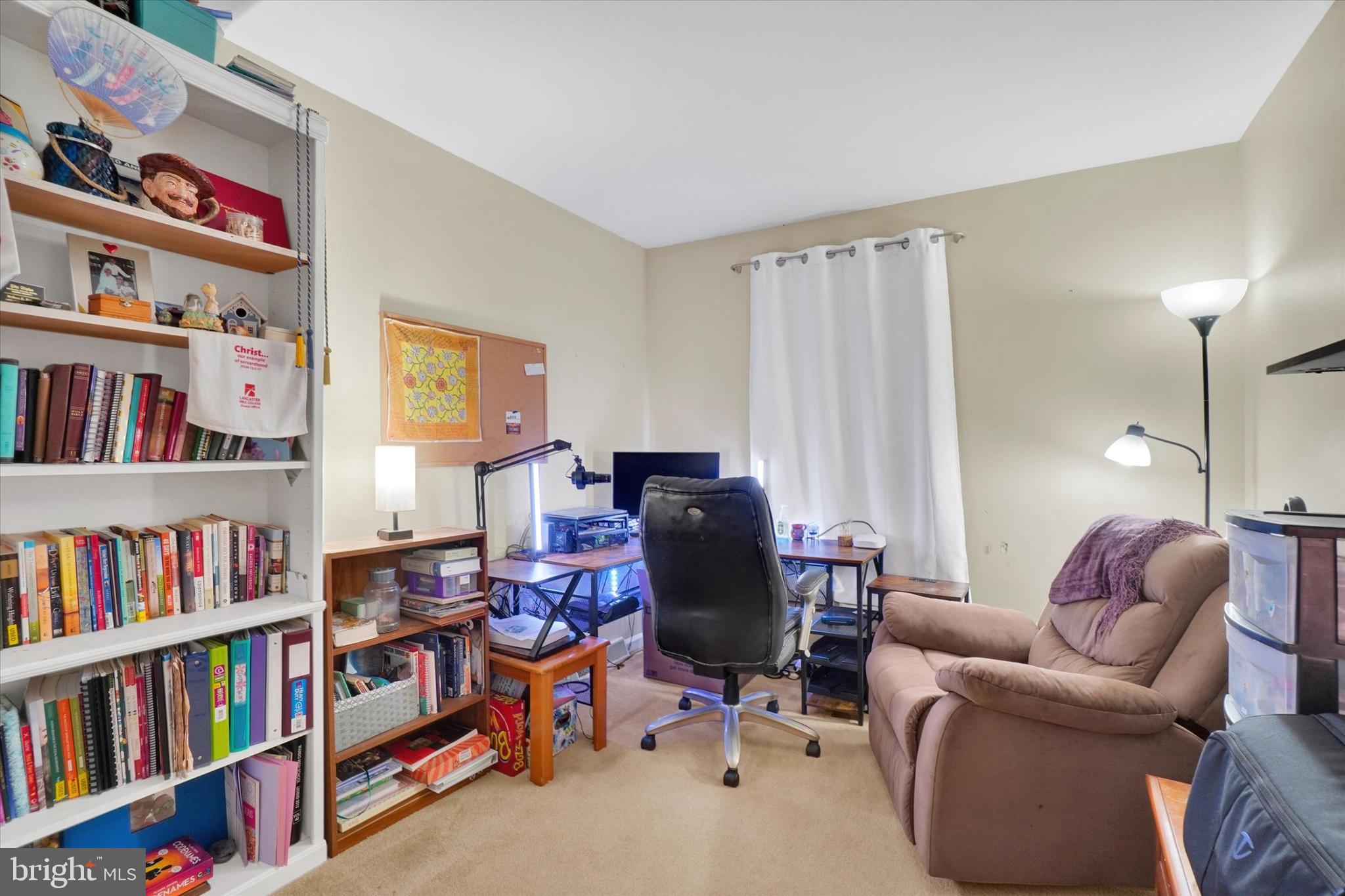 115 Oak Ridge Lane, Unit 115 Dallastown, PA 17313 - Photo 15 of 32 a view of a livingroom with workspace and a couch
