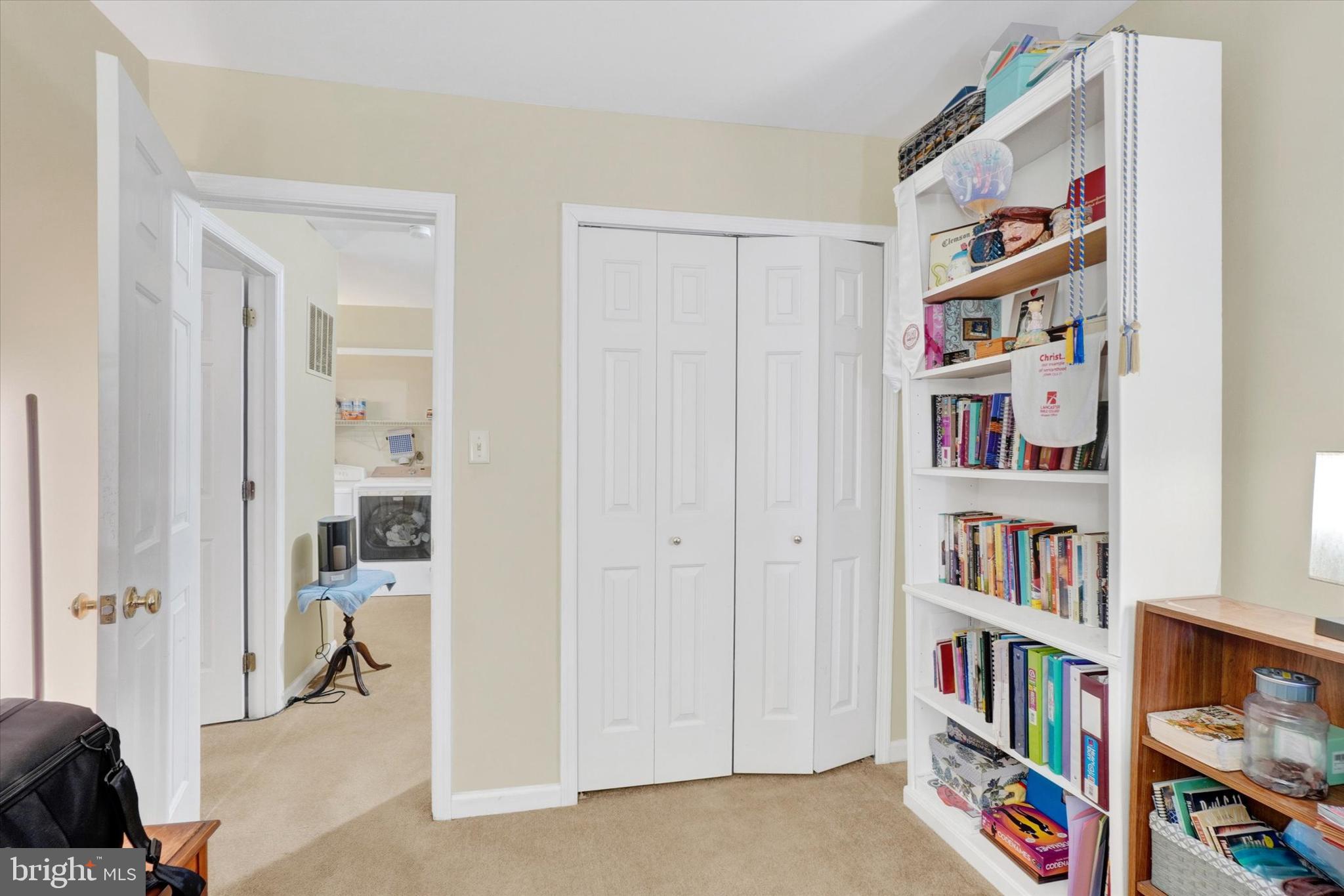 115 Oak Ridge Lane, Unit 115 Dallastown, PA 17313 - Photo 16 of 32 a livingroom with a book shelf with a living room