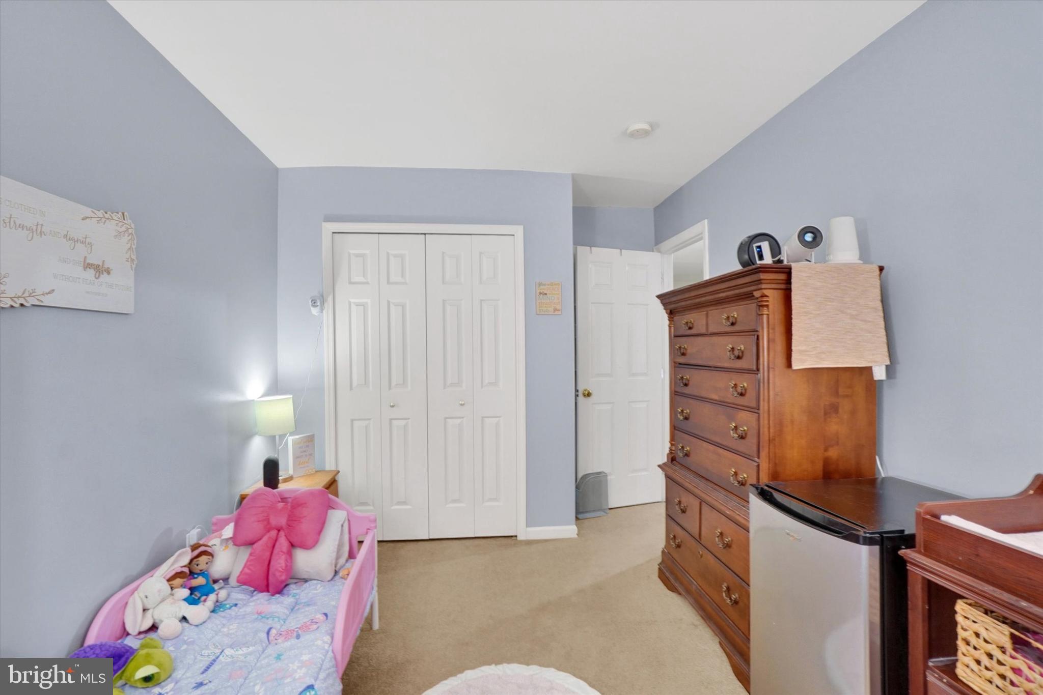 115 Oak Ridge Lane, Unit 115 Dallastown, PA 17313 - Photo 18 of 32 a bedroom with a bed and teddy bear on bed