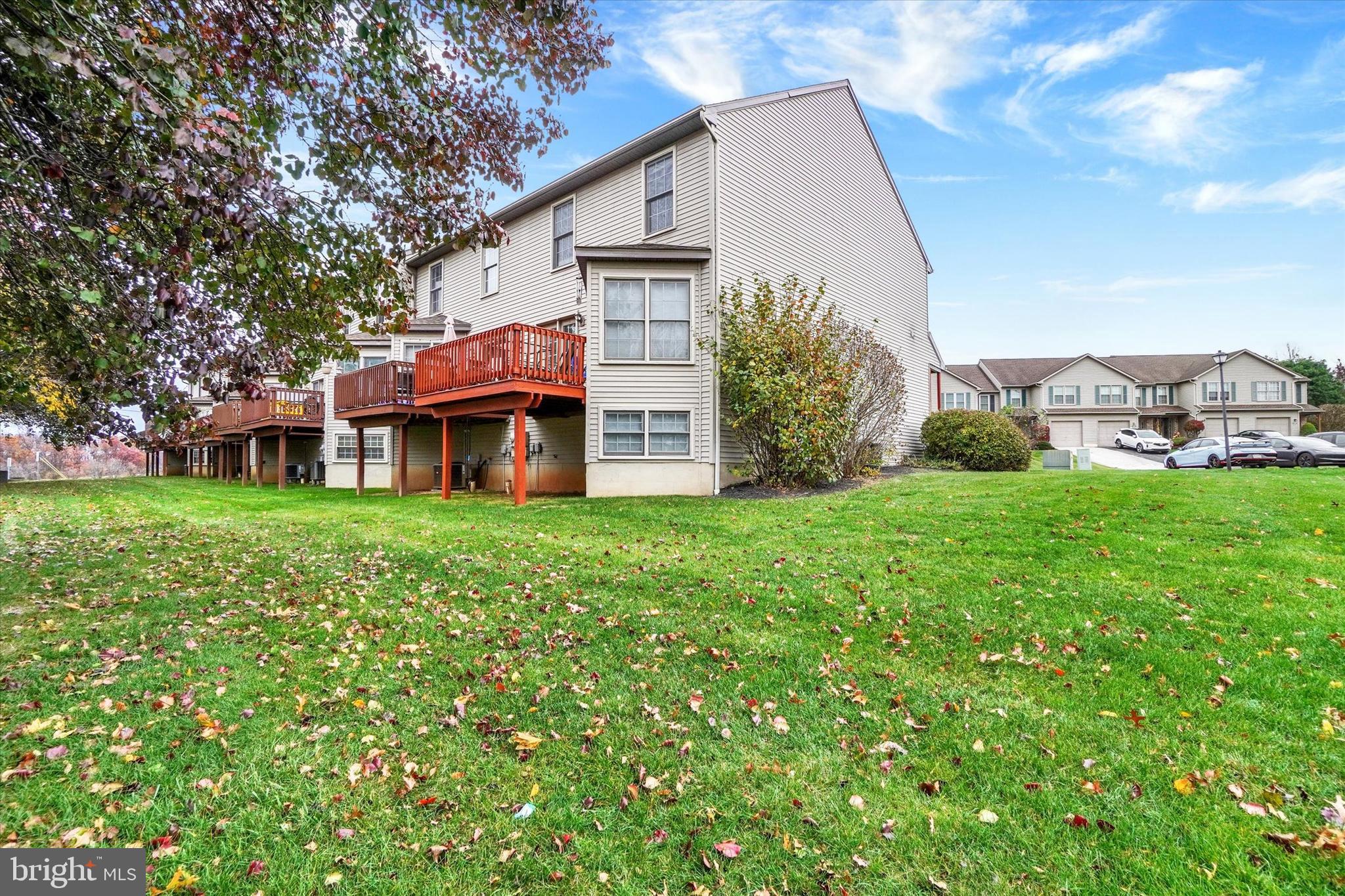 115 Oak Ridge Lane, Unit 115 Dallastown, PA 17313 - Photo 28 of 32 a view of a house with a yard and sitting area