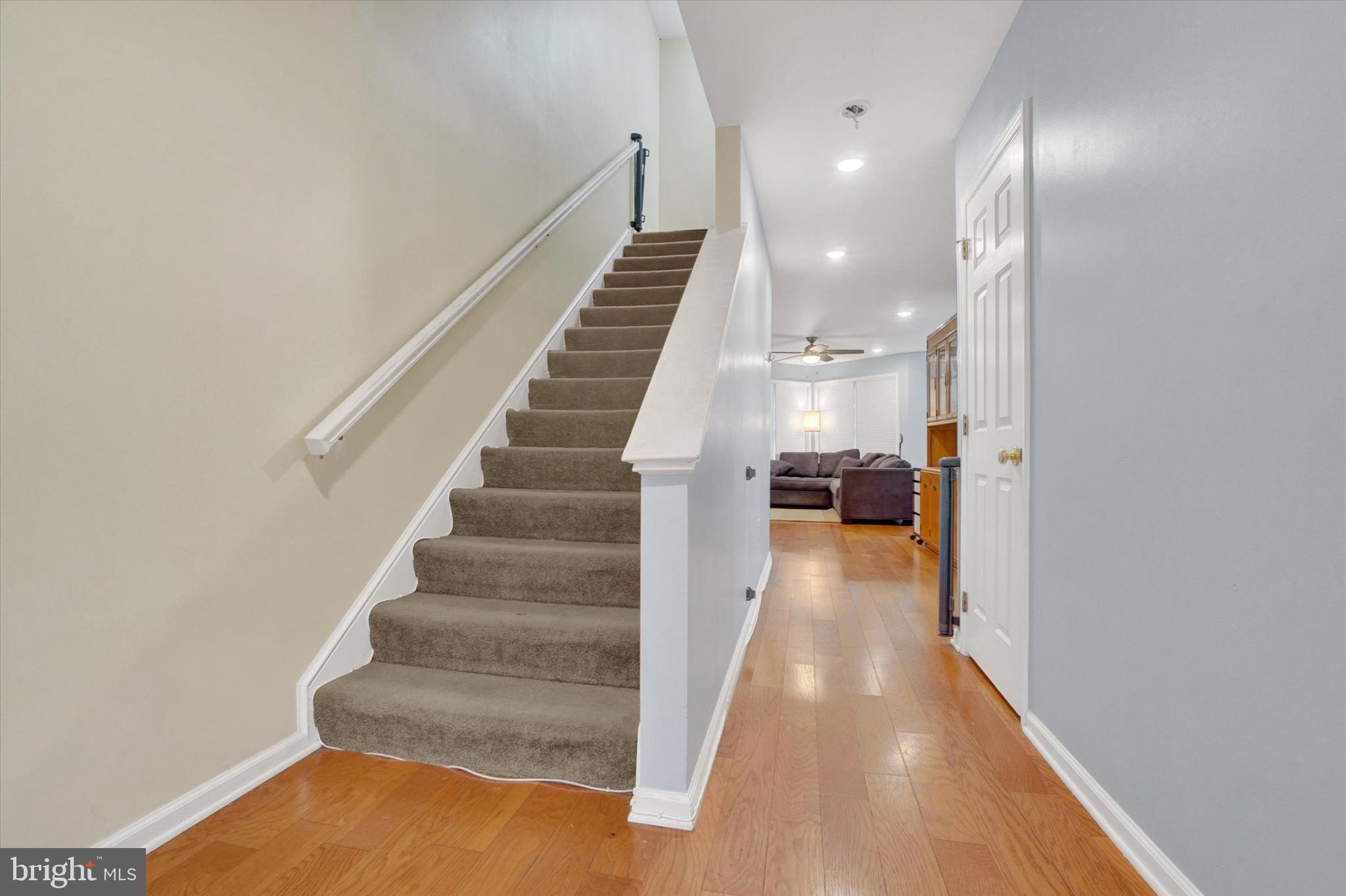 115 Oak Ridge Lane, Unit 115 Dallastown, PA 17313 - Photo 4 of 32 a view of entryway and hall with wooden floor