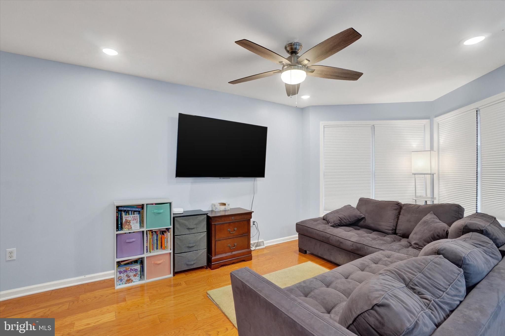 115 Oak Ridge Lane, Unit 115 Dallastown, PA 17313 - Photo 7 of 32 a living room with furniture and a flat screen tv