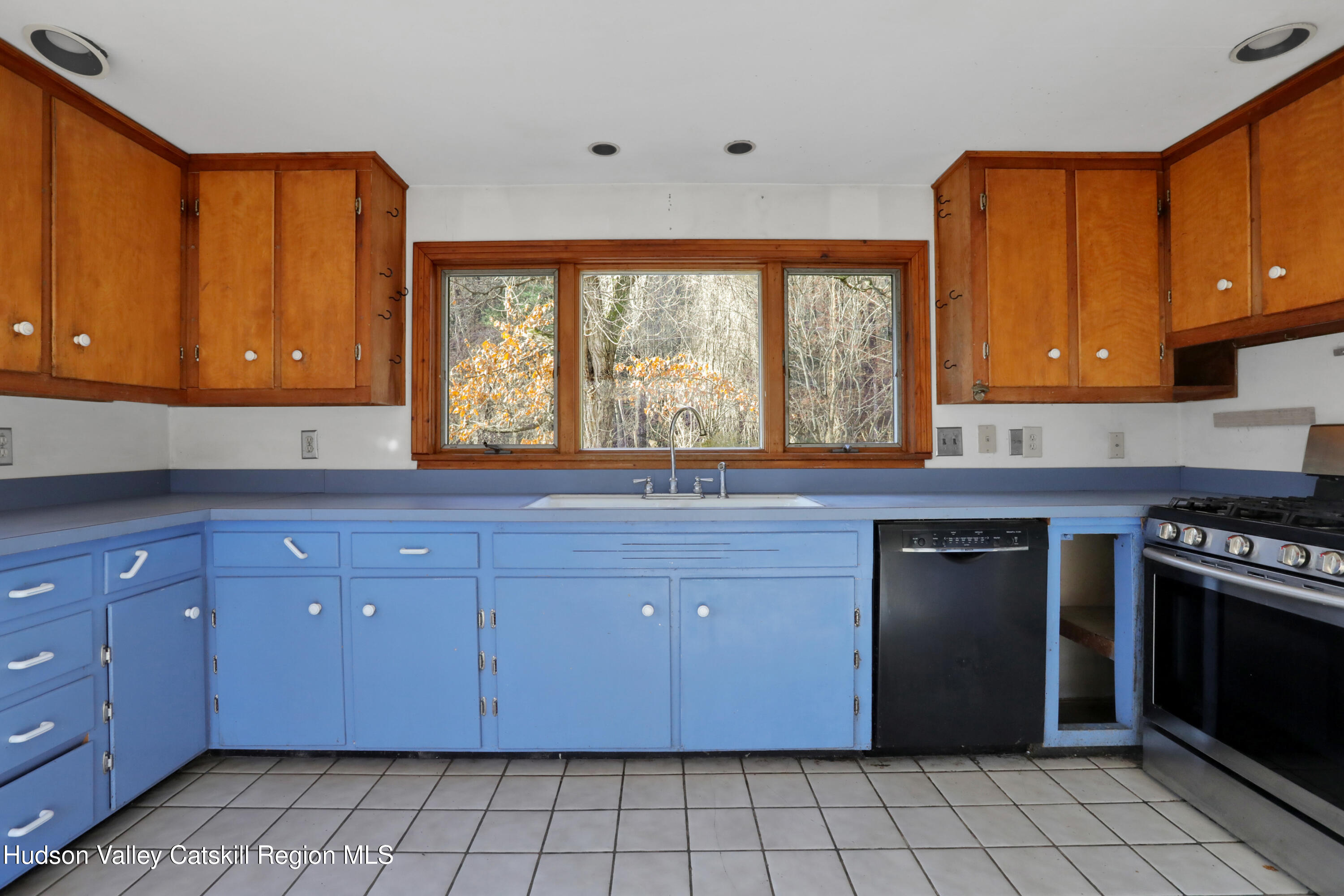 62 Andrew Lane Shandaken, NY 12457 - Photo 12 of 30 a kitchen with granite countertop a stove sink and cabinets