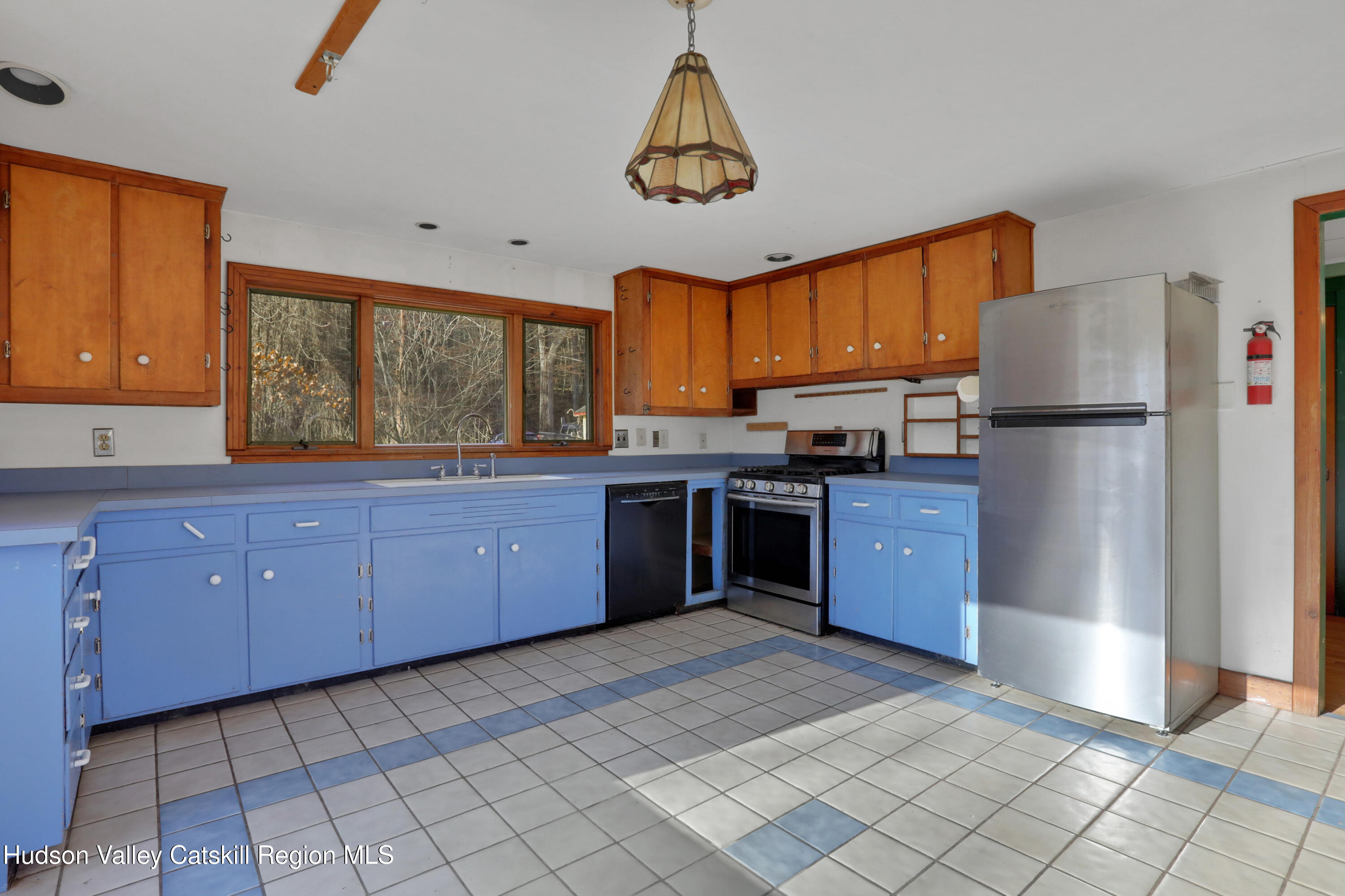 62 Andrew Lane Shandaken, NY 12457 - Photo 13 of 30 a kitchen with stainless steel appliances granite countertop a refrigerator a sink dishwasher a stove with wooden cabinets and floors