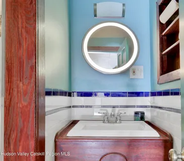 a living room with furniture a fireplace and a table
