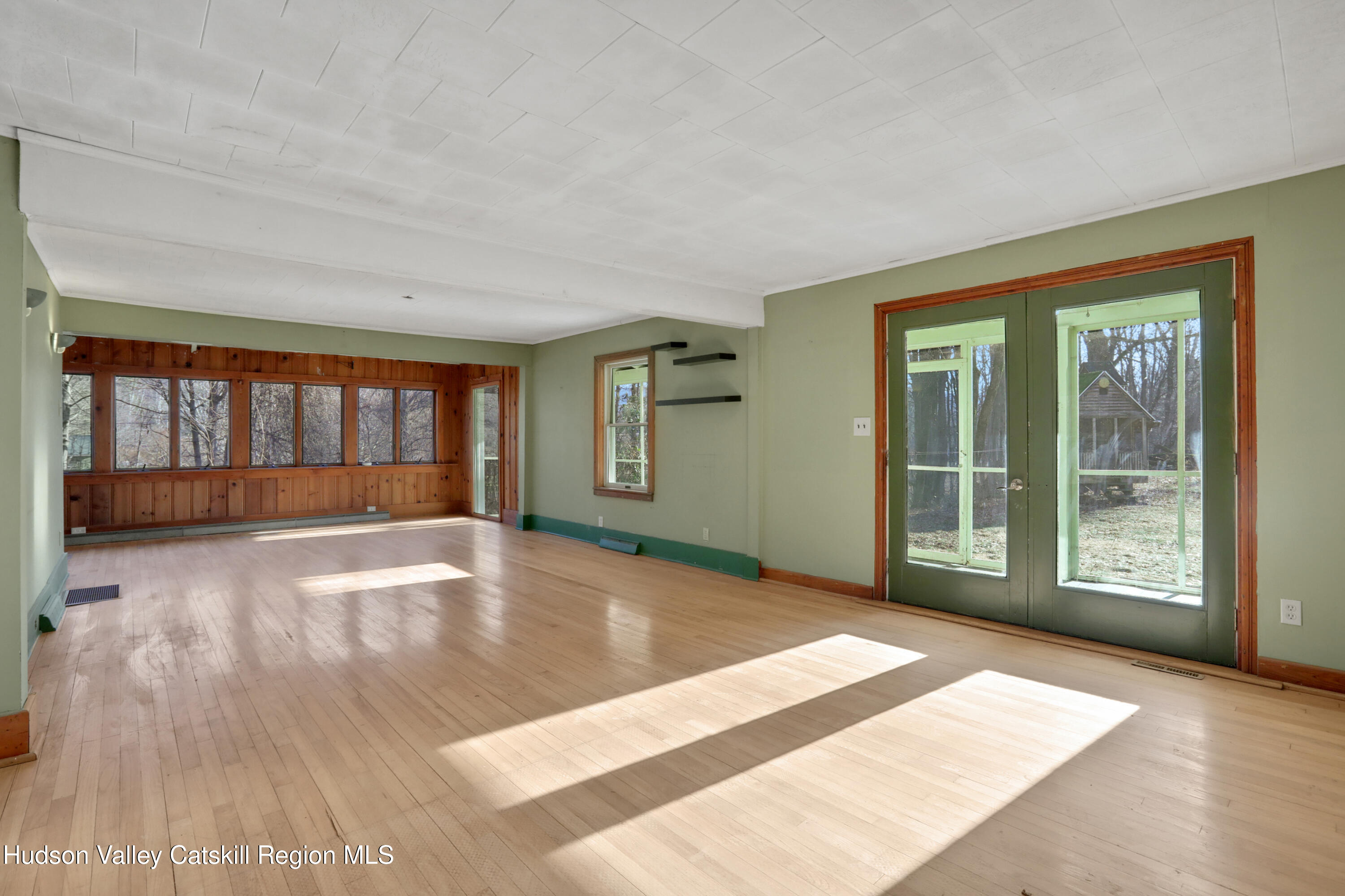 62 Andrew Lane Shandaken, NY 12457 - Photo 8 of 30 a view of an empty room with wooden floor and a window