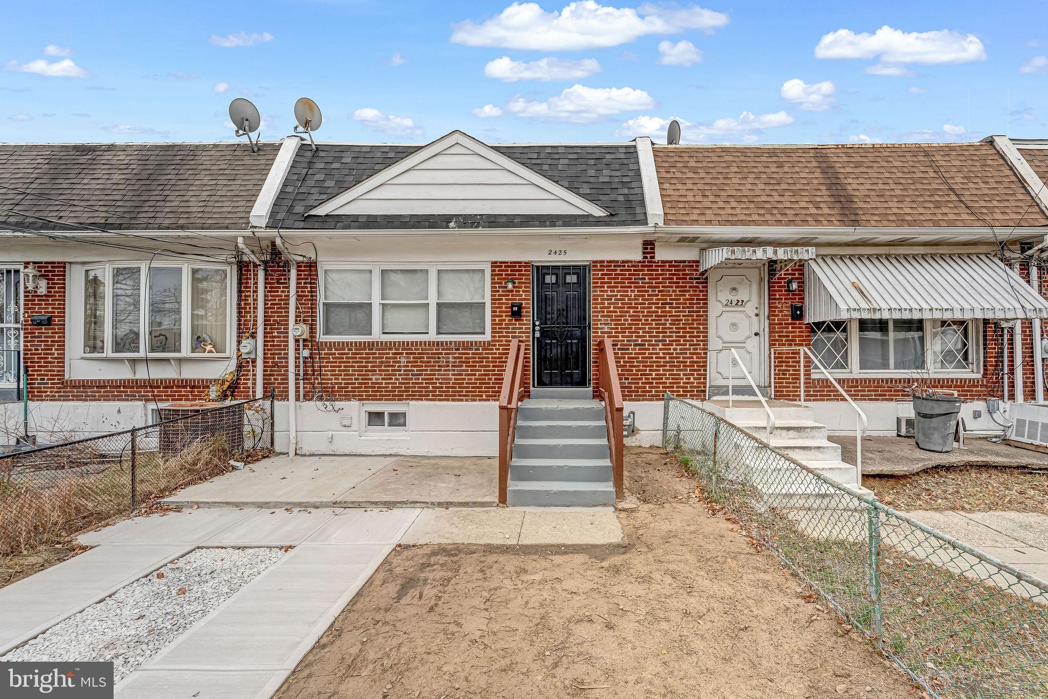 2425 Patton Street Camden, NJ 08104 - Photo 1 of 23 a front view of a house with a yard