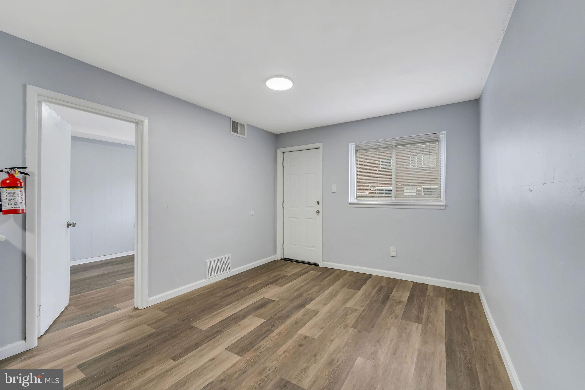 2425 Patton Street Camden, NJ 08104 - Photo 11 of 23 a view of an empty room with wooden floor and a window