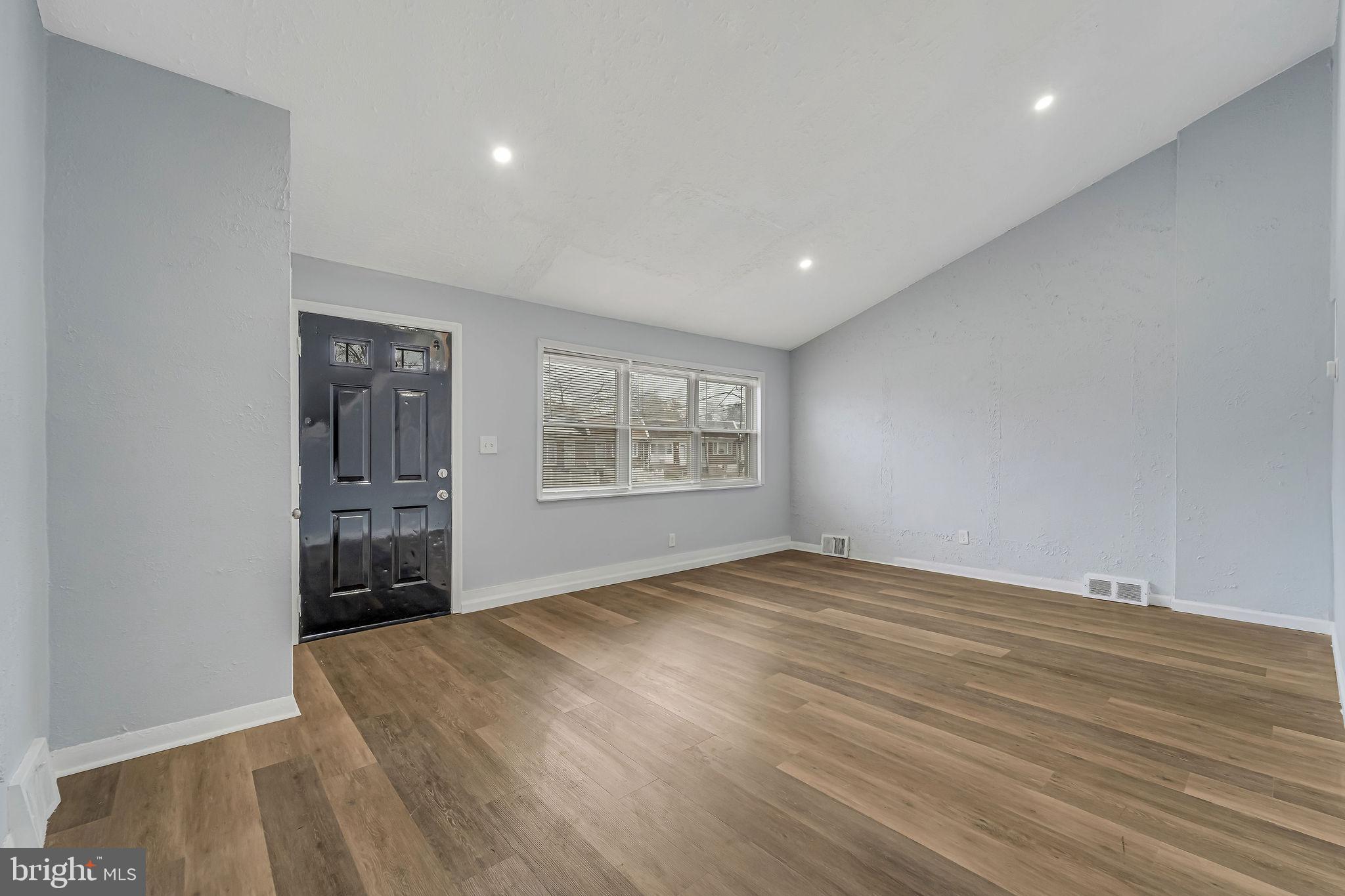2425 Patton Street Camden, NJ 08104 - Photo 3 of 23 a view of an empty room with a window and wooden floor