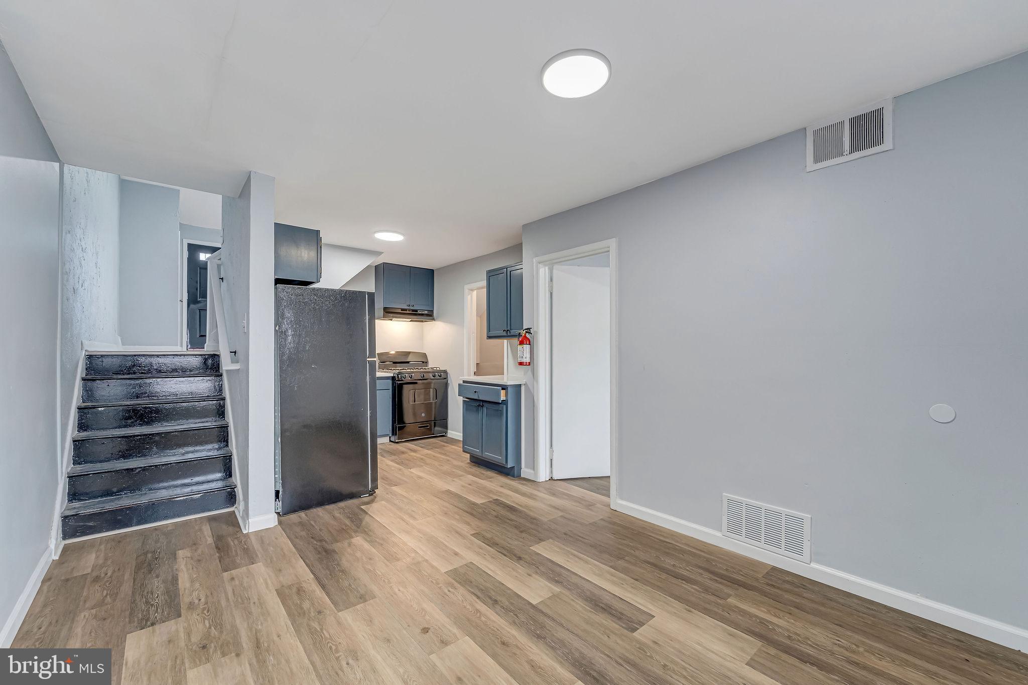 2425 Patton Street Camden, NJ 08104 - Photo 6 of 23 a view of a kitchen with wooden floor and a refrigerator