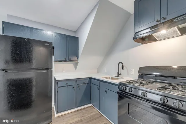 a kitchen with a stove and a refrigerator