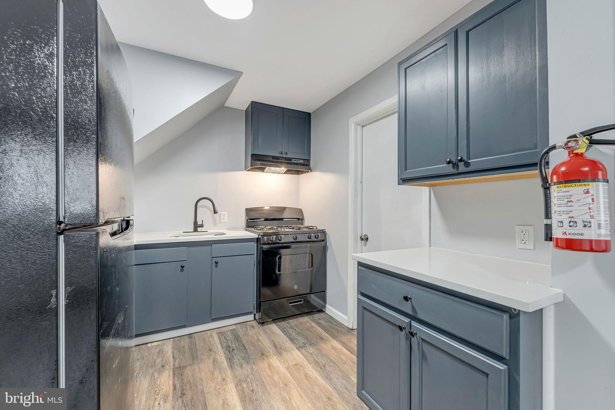 2425 Patton Street Camden, NJ 08104 - Photo 10 of 23 a kitchen with a sink cabinets and stainless steel appliances