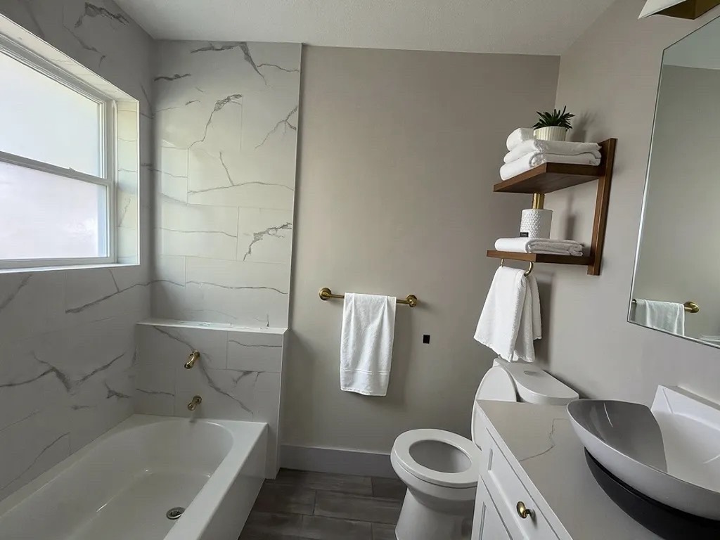 8335 Bonner Drive, Unit 3 Houston, TX 77017 - Photo 5 of 11 a bathroom with a sink toilet and bathtub