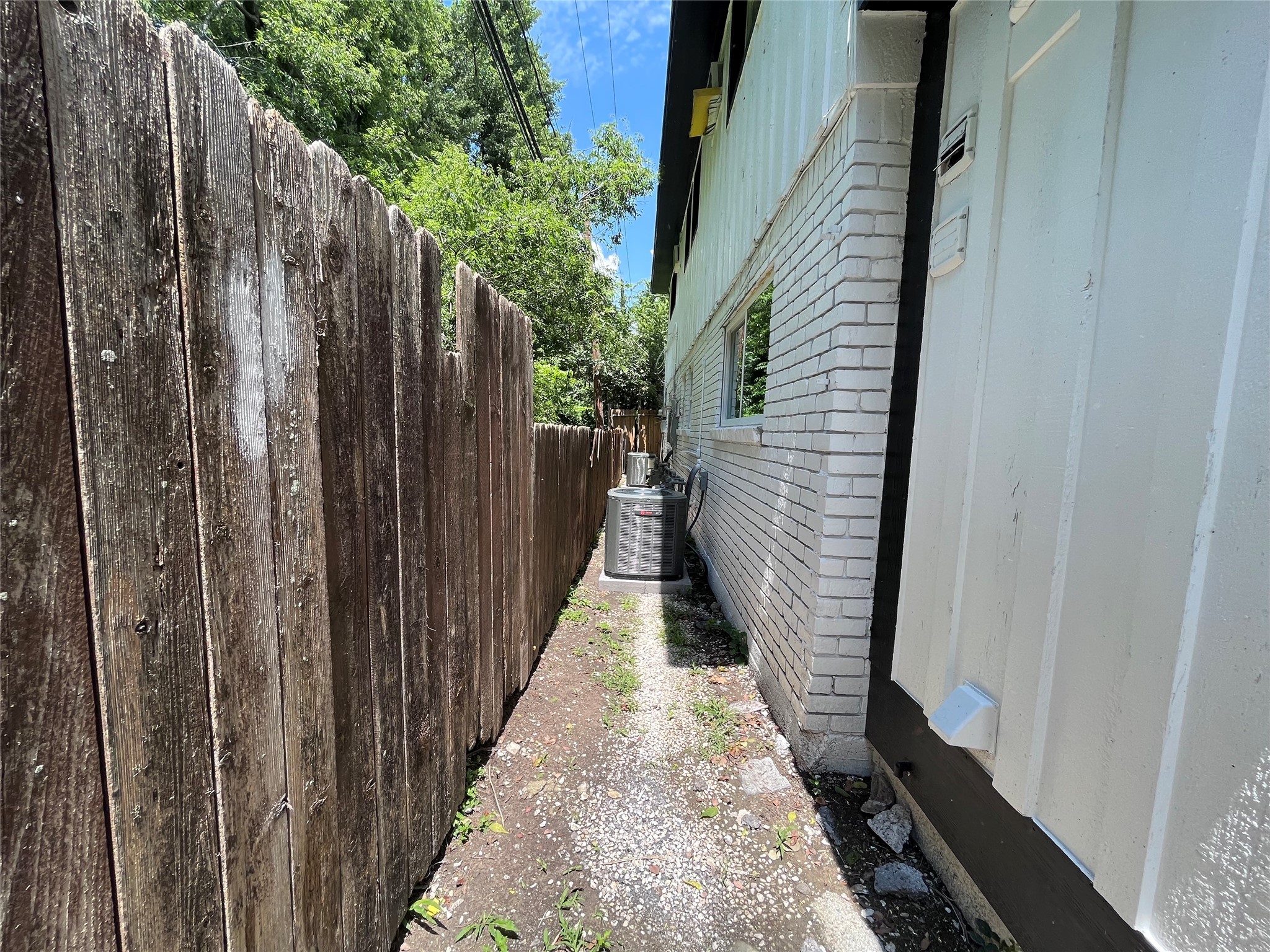 8335 Bonner Drive, Unit 3 Houston, TX 77017 - Photo 9 of 11 a view of a pathway of a house with wooden fence