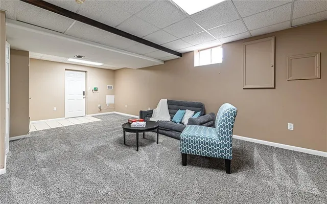 a view of a livingroom with furniture and a window