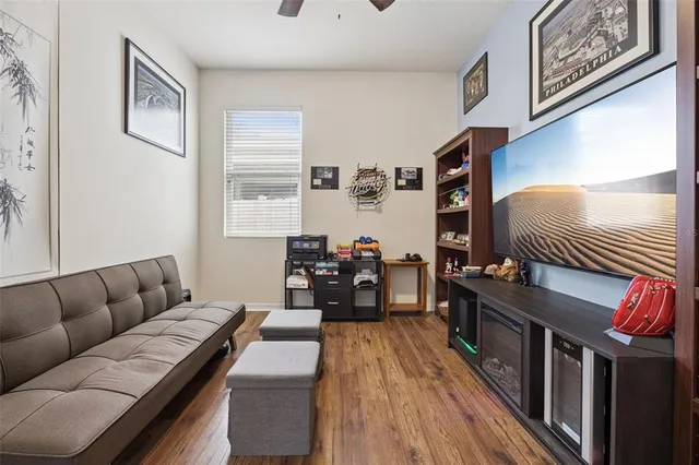 a living room with furniture or couch and a wooden floor