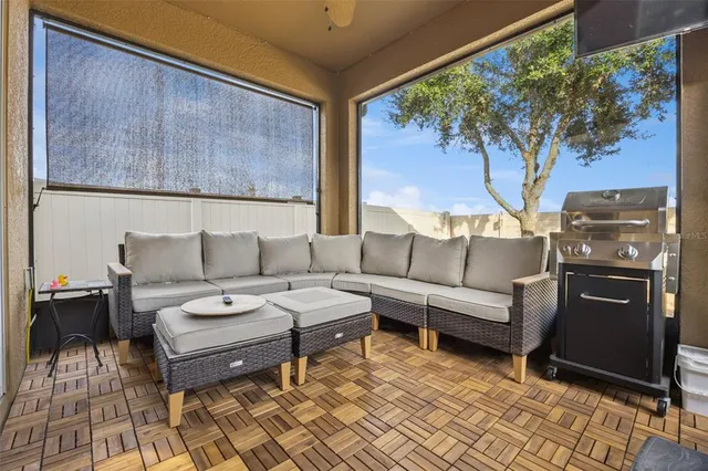 a living room with furniture and a large window