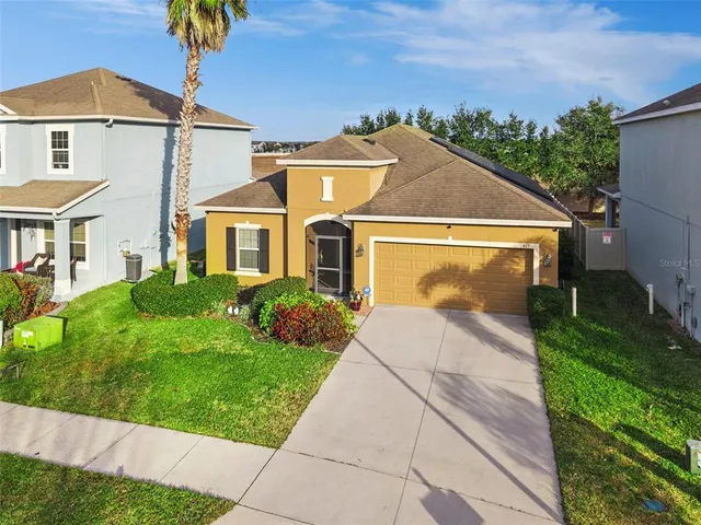 a view of front a house with a yard