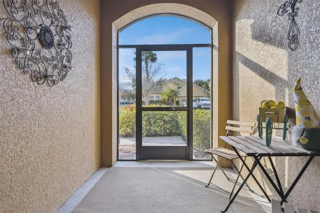 a view of a livingroom with furniture and front door