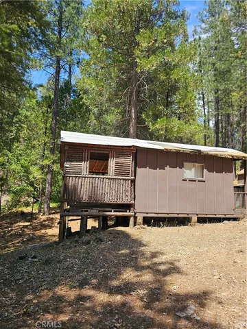 a view of a wooden deck with a trees