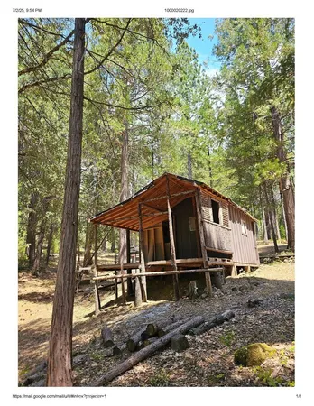 a house with trees in the background