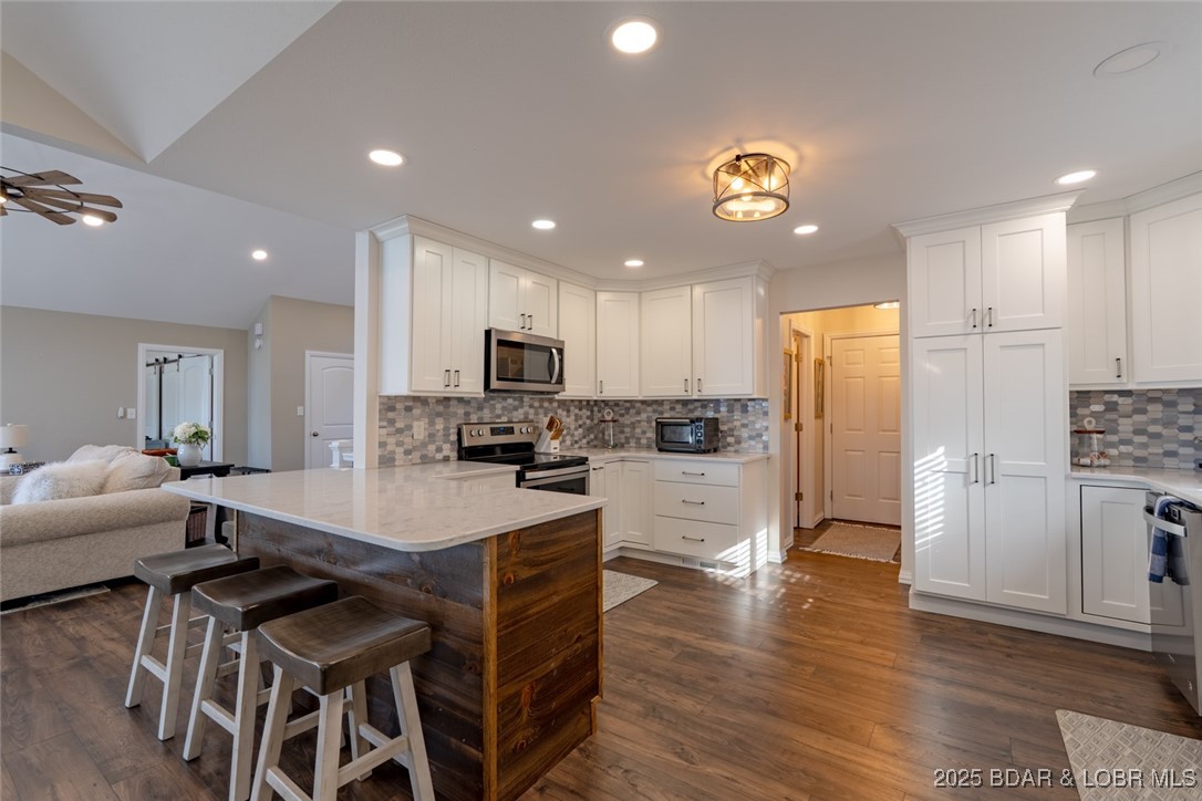 999 Imperial Point Drive Four Seasons, MO 65049 - Photo 16 of 74 Extra bar seating and extended counters.