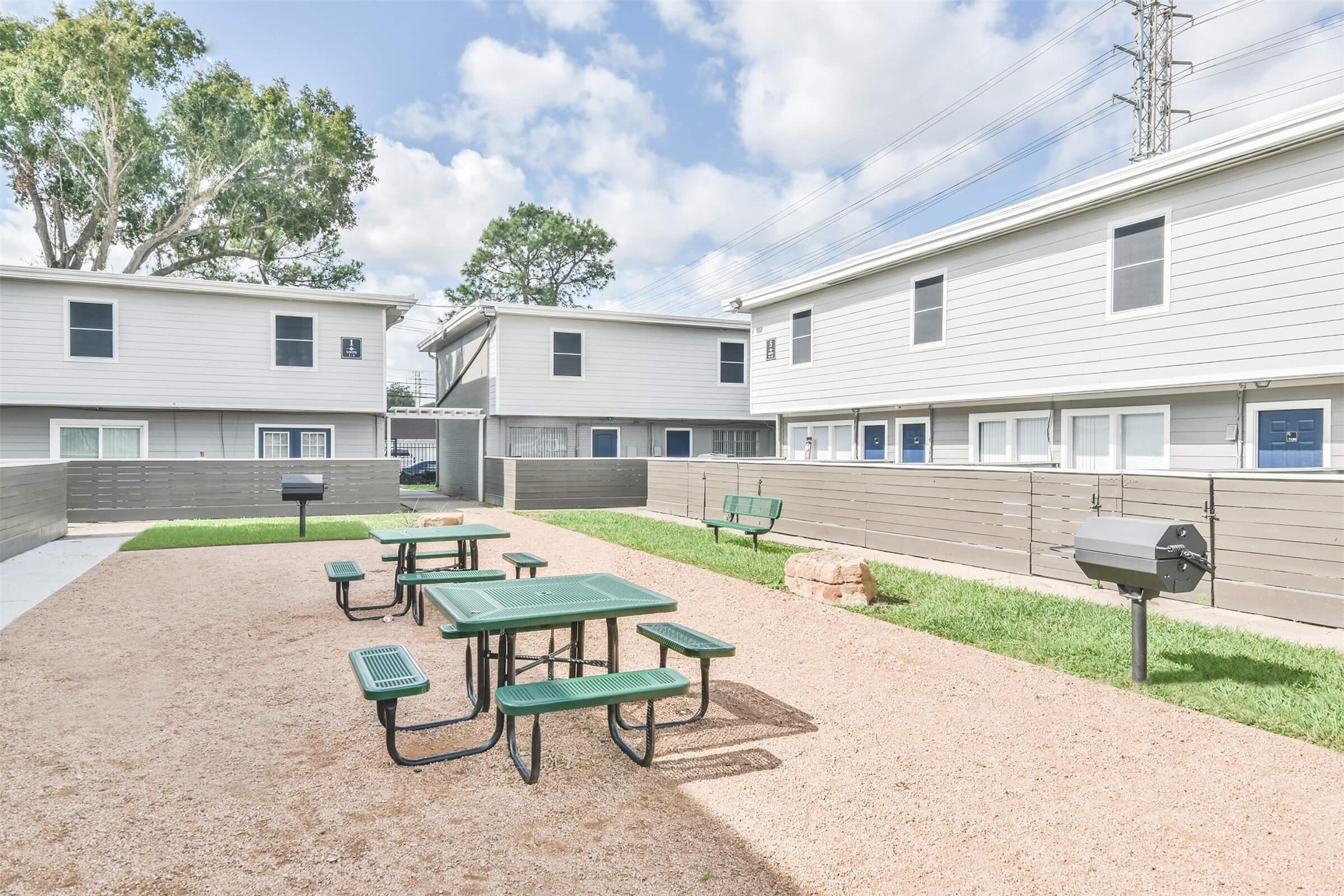 8271 Stone Street, Unit 7140 Houston, TX 77061 - Photo 23 of 28 a swimming pool with outdoor seating and yard