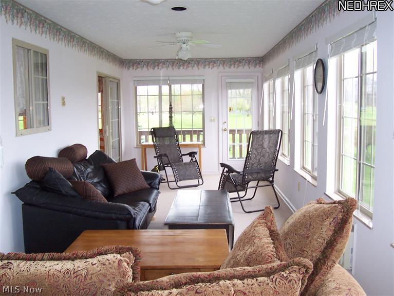 4330 Mayfair Road Uniontown, OH 44685 - Photo 13 of 19 sunroom/side porch, so peaceful!