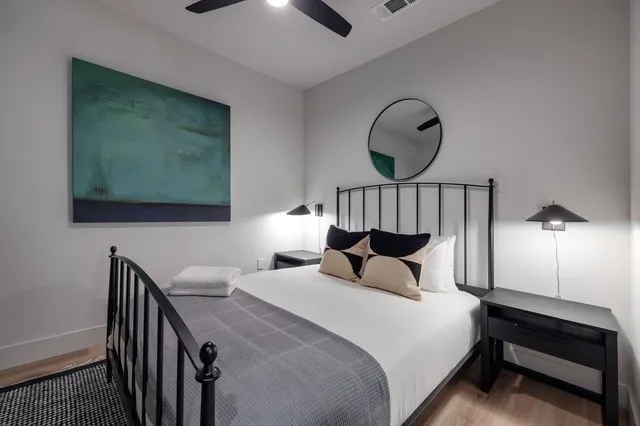 a bedroom with bed and a window