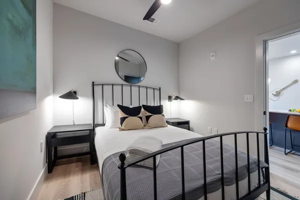 a bedroom with a large bed and a large window