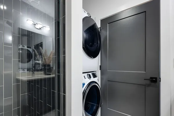 a view of walk in closet with wooden floor