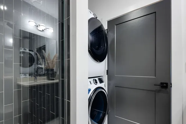 a view of walk in closet with wooden floor
