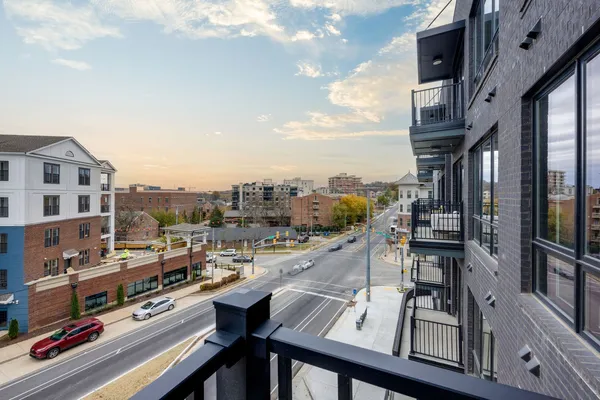 a bed sitting in a bedroom and a table